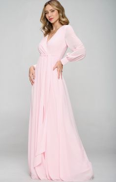 This gorgeous gown is ready to be worn to your most fabulous of events. Runs true to size. Sheer sleeve with crystal button details. Long Sleeve Bridesmaid Gown For Prom Season, Pink Chiffon Maxi Length Bridesmaid Dress, Elegant Pink Maxi Dress For Prom, Elegant Pink Prom Maxi Dress, Pink Maxi Length Evening Dress, Pink Maxi Length Evening Dress For Formal Occasions, Pink Maxi Length Formal Evening Dress, Elegant Pink Chiffon Gown, Pink Chiffon Wedding Gown