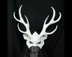 *Made to order 2 weeks* Leather mask of deer with tall elaborate antlers. Antlers are reinforced with armature wire, felt lining and resin filling behind all tips. Antlers are approx 14 inches high.  The stag is large and dramatic yet sleek in design. An amazing statement piece finished in ghostly bone white.  Looks perfect on men or women. Ties with shock cord on sliding cord lock.  Inside is fully sealed in gold paint and lined where antlers are attached.  Light enough to be worn for extended Funky Suits, Keyleth Cosplay, The Two Princes, Werewolf Mask, Children Of Eden, Deer Mask, Narnia Costumes, Deer With Antlers, Two Princes