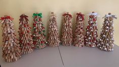 a group of wooden christmas trees sitting on top of a table