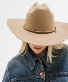 From coffee dates to country music festivals, the Teddy Cattleman Hat has you covered. With a true cattleman crown + wide western brim, this classic cowgirl hat is sure to stand out in a crowd. May we suggest taking Teddy up a notch? Shop Western bands + your favorite hat trims to make the look your own! Bands pictured sold separately HERE! Western Beige Felt Hat For Rodeo, Black Western Felt Hat With Curved Brim, Women’s Felt Cowboy Hat, Luxury Brown Felt Western Hat, Cattleman Hat, Luxury Black Western Felt Hat, Classic Cowgirl, Country Music Festival, Western Hat