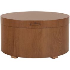 a round wooden box sitting on top of a table