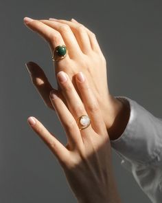 Enviable with its handmade craft the Neon ring features repurposed gold for sustainable shine. The green malachite stone highlights your finger with its cabochon cut. This piece is made to order just for you so please allow 3-6 weeks for your item to ship. This item is final sale. 9k gold (ring) 14k gold (setting) and malachite cabochon Gold: repurposed Clean with soft cloth Stone sourced from India Handmade in Antwerpen Belgium | Nayestones Neon Malachite Ring 8 | Gemstones/Yellow Gold Timeless Emerald Ring With Polished Finish, Luxury Oval Rings With Natural Stones, Formal Dome Ring With Open Ring Gemstone, Yellow Gold Rings With Natural Stones, Emerald Open Ring With Polished Finish, Fine Jewelry Pearl Ring With Polished Finish, Fine Jewelry Pearl Ring With Polished Open Ring, Classic Rings With Natural Stones, Elegant Emerald Dome Ring