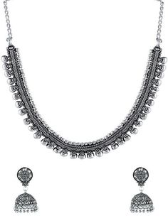 This jewellery set consists of a necklace and a pair of earrings Oxidized silver-plated necklace, has Kolhapuri work, has a chain secured with S-hook closure Comes with a matching pair of jhumka earrings, secured with a push and back closure Size & Fit Dimensions Of Necklace: 46.5 cm x 1.5 cm (Length x Width) Dimensions Of Earrings: 4.5 cm x 1.5 cm (Length x Width) Each Material & Care Material: German Silver Plating: Silver-Plated Care Instructions: Wipe your jewellery with a soft cloth after every use Always store your jewellery in a flat box to avoid accidental scratches Keep sprays and perfumes away from your jewellery Do not soak your jewellery in water Clean your jewellery using a soft brush, dipped in jewellery cleaning solution only Dispatch within 7 days Festival Metal Necklace With Matching Earrings, Festival Metal Necklaces With Matching Earrings, Metal Jewelry Sets With Matching Earrings For Festivals, Oxidized Metal Jewelry Sets, Traditional Silver Jewelry Sets With Matching Earrings, Silver Dangle Temple Jewelry Necklace, Traditional Silver Dangle Jewelry Sets, Silver Necklaces With Matching Earrings For Festive Occasions, Silver Dangle Jewelry Sets For Festivals