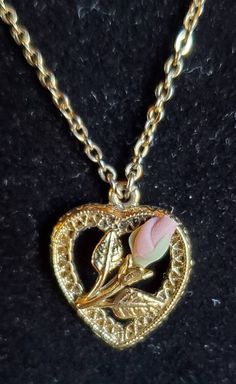 "Famous 1928 brand set of matching jewelry with a locket necklace, pierced earrings and bar pin.   Gold tone filigree with small pink rose and rose buds.  Necklace has a 16\" chain with a heart shaped locket that is about 3/4\" long.  Pin is 1 1/4\" long and the earrings are 1/2\".  Please take a look at all the pictures." Vintage Flower Pendant Jewelry For Mother's Day, Victorian Jewelry With Hallmark For Valentine's Day, Collectible Pendant Jewelry For Valentine's Day, Valentine's Day Flower Pendant Jewelry With Rose Design, Valentine's Day Rose Design Flower Pendant Jewelry, Vintage Jewelry With Rose Design Flower Pendant, Vintage Charm Heart Pendant Jewelry For Mother's Day, Vintage Charm Jewelry For Valentine's Day Formal, Vintage Charm Jewelry For Valentine's Day Formal Occasion