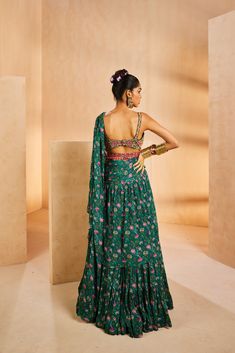 It features a chintz-printed tiered pre-draped sari. It features a very intricately fully hand-embroidered blouse with colourful miniature beads. The belt adorned with boho beads accentuates the sari further.From Aneesh Agarwaal's Seher collection.DELIVERY TIMEPlease allow 8-12 weeks for your outfit to arrive.FABRIC DETAILSChinonProfessional cleaning only. Boho Beads, 12 Weeks, Your Outfit, Embroidered Blouse, Body Measurements, Hand Embroidered, Saree, Beads, Green