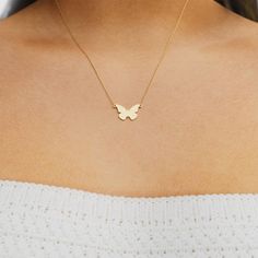 Hearts will flutter at the sight of the mini plain butterfly necklace. This butterfly-shaped pendant is fixed to a delicate chain, creating an effortlessly charming necklace. Add a dose of whimsy to your necklace stack, or wear it on its own for a simply sweet look. Dainty 14k Gold Butterfly Necklace With Charm, Minimalist Yellow Gold Butterfly Necklace, Dainty Butterfly Shaped Jewelry With Delicate Chain, Dainty Butterfly Jewelry With Delicate Chain, Dainty Butterfly Charm Necklace With Clavicle Chain, Dainty Butterfly Charm Necklace With Delicate Chain, Dainty Everyday Jewelry With Butterfly Charm, Dainty Butterfly Pendant Necklace With Delicate Chain, Delicate Butterfly Charm Necklace