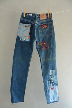 "Ready to send:Size-30 Unique vintage jeans One of a kind.. Hand made embroidery and unique patches. ---Or---- Made to order, in any size, within 6 working days . If you need different size, please send me a message and I will make you a special and unique design within 2 working days. They are all different! No one will have the same one as you have! Hand painted, one of kind jeans. You pick your size, model (slim- boyfriend- high waist- low waist) and primer color and you will get your singula Casual Reworked Jeans For Festival, Straight Leg Denim Jeans With Collage Stitching, Hippie Cotton Jeans With Pockets, Bohemian Reworked Denim Jeans, Hippie Reworked Denim Bottoms, Hippie Style Upcycled Denim Bottoms, Hippie Upcycled Denim Bottoms, Upcycled Cotton Jeans For Festivals, Blue Bohemian Reworked Jeans