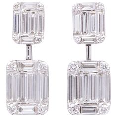 An AMAZING earring! 1.37 carats of round and special cut F color VS clarity diamonds give an illusion Emerald cut diamond look. Set in 18k white gold. The combination of the different cuts give these earrings a special sparkle. A wonderful gift -- longer earrings of the same design are available in our 1stDibs store. Approximately 0.60 inches in length. Emerald Cut Drop Earrings, Emerald Cut Diamond Earrings, Diamond Danglers, Gold Diamond Drop Earrings, Dangler Earrings, Fantasy Closet, Diamond Dangle Earrings, Emerald Cut Diamond, Emerald Earrings