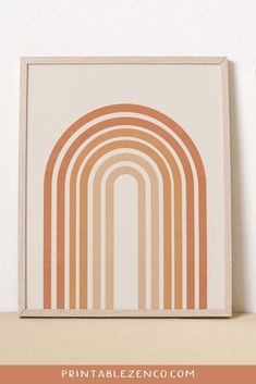 an orange and white art print on a shelf