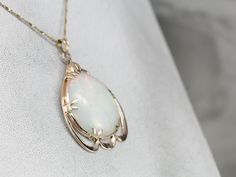 This vintage rose gold pendant is a great frame for the outstanding Opal gemstone that we've set at the center. This is a wonderful stone, filled not only with greens and oranges but also with a rare, pink glow at the center! The perfectly proportioned teardrop shape creates an outstanding profile along the throat. This pendant does not come with the chain shown. Please feel free to contact us, we will help you find the perfect chain for your style and budget! Metal: 10K/18K Rose Gold Gem: Opal Pendant Settings, Vintage Rose Gold, Cameo Ring, Rose Gold Pendant, Cabochon Pendant, Statement Pendant, Oval Pendant, Vintage Rose, Opal Necklace