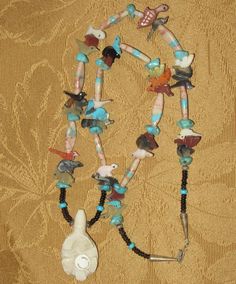 "An Original 1970's Running Bear Shop Signed Boulder Ribbon Turquoise & Sterling Necklace. Visit this shop for a wide variety of Vintage Quality Jewelry, Art, Photos and Collectibles. ~Age (approximate): 1970's ~Material(s): Turquoise & Sterling ~Approx. Size: necklace measures 15\" long & Pendant measures 2 1/4\" long ~Approx. Weight: N/A ~Signature / Brand: Signed. There is a pendant on the clasp that is marked R. B. (Inside A Bear) Sterling. ~Condition: Excellent. Clasp A Bit Tarn Collectible Turquoise Necklace With Natural Stones, Spiritual Turquoise Necklace Collectible, Handmade Southwestern Style Collectible Necklaces, Turquoise Spiritual Necklace With Inlay, Spiritual Turquoise Inlay Necklace, Spiritual Turquoise Necklace With Inlay, Vintage Multicolor Turquoise Necklace With Natural Stones, Running Bear, Sterling Necklace