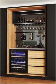 an open cabinet with wine glasses and bottles on the shelves, in front of a bar