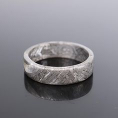 Material: Iron meteorite (mainly iron and nickel) Shape: Circular Purpose: Ring Ring size:10.5(US) Inner diameter: 20.5mm Width: 5mm Thickness: 1mm Please note that this product has some defects, please look at the photos and videos carefully, thank you for your cooperation! Meteorite Fossil Ring, Meteorite Wedding Rings, Bone Ring, Iron Meteorite, Meteorite Ring, Size 10 Rings, Ring Ring, Wedding Shop, Jewelry Box