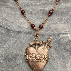 Sacred Heart Necklace Catholic Solid Bronze Pearls and Garnets - Etsy Bronze Heart-shaped Necklace For Valentine's Day, Bronze Heart Necklaces For Valentine's Day, Handmade Bronze Jewelry For Valentine's Day, Bronze Heart-shaped Brass Necklaces, Handmade Brass Heart Pendant Jewelry, Handmade Bronze Heart Necklace, Bronze Heart-shaped Brass Necklace, Bronze-colored Copper Heart-shaped Jewelry, Bronze Heart Necklaces For Jewelry Making