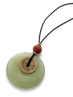 This pendant features genuine carnelian and jade, with a reproduction I-Ch'ing coin. Due to the genuine quality of the jade stone, the color will vary. The ancient Chinese tossed yarrow stalks and later coins to help make decisions that were based on the patterns of the toss as they related to the I Ch'ing, The Book of Change. Our pendant necklace hangs from a 36-inch cotton waxed cord. There is a knot closure with bead to hold it in place artfully. This necklace comes shipped in a jewelry box w Jade Necklace Pendant, Chinese Accessories, Chinese Jewelry, I Ching, Coin Pendant Necklace, Jade Necklace, Jade Stone, Ancient Chinese, Coin Pendant