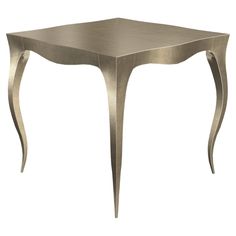 a metal table with curved legs and a square shaped design on the top, against a white background