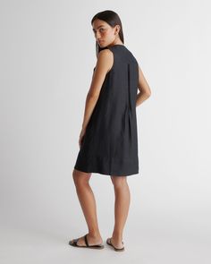 Sleeveless style with a little swing. This spring summer staple can do it all. Featuring pin-tucking up top, shell buttons, and pleat detailing. Our linen collection is made from 100% European flax linen—an eco-friendly, and resource light material.  | Quince | Women's 100% European Linen Sleeveless Swing Dress in Black, Size XL Spring Sleeveless Workwear Dress With Pleated Back, Spring Workwear Sleeveless Dress With Pleated Back, Casual Pleated Sleeveless Dress For Vacation, Summer Sleeveless A-line Dress With Pleated Hem, Casual Knee-length Pleated Sleeveless Dress, Chic Sleeveless Summer Dress With Pleated Back, Casual Linen Sleeveless Dress For Work, Casual Sleeveless Linen Dress For Work, Black Sleeveless Linen Dress Casual