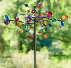 a wind spin with colorful glass balls on it