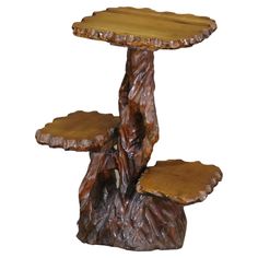 a wooden table with two tiers on it's sides and a tree stump in the middle