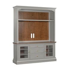 a gray entertainment center with wooden doors and drawers