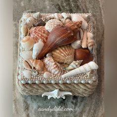 there is a cake made out of seashells and pearls