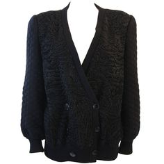 This is a Valentino design. This cardigan style jacket features front Broadtail panels and a quilted knit. The jacket is silk lined and double breast style. Made in Italy. Measures (Approximately) Length: 28.5" Sleeve: 25" Bust: 44" Waist: 38"-42" Luxury Wool V-neck Outerwear, Elegant Textured Knit Long Sleeve Outerwear, V-neck Winter Evening Outerwear, Elegant Long Sleeve Textured Knit Outerwear, Elegant Textured Knit Outerwear For Work, Fitted Textured Knit V-neck Outerwear, Luxury V-neck Outerwear For Formal Occasions, Designer V-neck Fall Outerwear, Fitted Textured Knit Elegant Outerwear