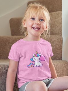 Discover pure magic with our Unicorn Bubblegum Toddler Tee! Crafted for comfort and designed to spark joy, this fine jersey tee is perfect for your little one's adventures. Authentic, playful, and bursting with vibrant colors, it's a treasure for the whimsical heart. 🦄✨ #UnicornTee #ToddlerFashion .: 100% combed, ring-spun cotton (fiber content may vary for different colors) .: Light fabric (4.5 oz/yd² (153 g/m .: Classic fit .: Tear-away label .: Runs true to size Funny Pink Tops With Cartoon Print, Funny Pink Cartoon Print Tops, Kawaii Crew Neck Pre-shrunk Top, Cute Short Sleeve Tops With Unicorn Print, Cute Pink T-shirt With Cartoon Print, Fun Crew Neck Tops With Unicorn Print, Cotton Crew Neck Top With Unicorn Print, Pink Cotton Tops With Unicorn Print, Playful Crew Neck T-shirt With Cartoon Print