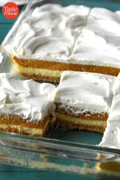 a cake with white frosting in a glass dish