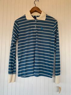 "NEW with original tags! NWT 80s Vintage Garan Blue White Striped Long Sleeve Polo Shirt. Partial button up with classic Horse Logo. Size Medium. Authentic vintage deadstock from the early 80s, New With Tags! Brand - Garan 65% Polyester 30% Cotton Machine Washable Made in USA Condition - Original Deadstock from the 80s, New With Tags Vintage Size - Medium Fits Like - Medium, can also fit Small with looser fit (see measurements) Measurements (Seam to seam, lying flat) - Bust* - 36\" Waist* - 38\" Logo Hipster, Horse Logo, Long Sleeve Polo Shirt, 80s Vintage, Long Sleeve Polo, Striped Shorts, Striped Long Sleeve, Vintage Tags, Vintage Tops