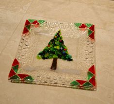 a glass plate with a christmas tree on it