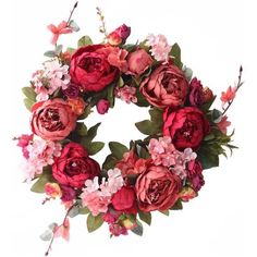 a wreath with red and pink flowers on it