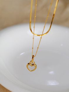 Our stunning Double-sided Love Lock Pendant Necklace is a perfect symbol of love and commitment. Made with genuine 925 sterling silver, its intricate design showcases unbreakable bonds and lasting affection. The pendant's versatility allows you to switch between two beautiful sides, making it a wonderful addition to any jewelry collection. Show your love and devotion with this timeless and heartfelt necklace. Metal: 18K Recycled Gold Plated Vermeil on Recycled Sterling Silver Gemstone:Black Onyx Mother Of Pearl Pendant, Lock Pendant, Love Lock, Lock Necklace, Romantic Gestures, Charm Pendant Necklace, Gemstone Necklace Pendant, Recycled Gold, Recycled Sterling Silver