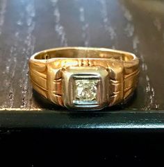 A 14kt yellow gold antique old European cut diamond ring.  Size 7 1/8. Diamond bead set in white gold.   Condition is good for its age-wear commensurate with age.  THE DIAMOND is an old EUROPEAN or miner cut diamond-the diamond faceting is good there is a bit of a typical inclusion(carbon)-not noticeable when worn only mentioned for accuracy.  It has a Deco styled shank with some wear from age but -smooth wear commensurate with its age.  Circa first half of the 1900s.  Easy statement ring to wea Collectible 14k Gold Diamond Ring With Rose Cut Diamonds, Antique Yellow Gold Diamond Ring With Diamond Cut, Vintage Diamond White Diamond Ring For Formal Occasions, Vintage Yellow Gold Signet Ring With Rose Cut Diamonds, Vintage 14k Gold Wedding Ring With Diamond Accents, Classic Diamond Signet Ring Collectible, Antique Yellow Gold Jewelry With Single Diamond, Vintage Yellow Gold Rings With Diamond Accents, Vintage Yellow Gold Rings With Rose Cut Diamonds