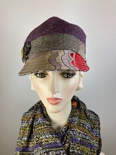 This pretty purple, beige, red and black baseball style multi fabric newsboy cap is a standout! It is made with lovely sample fabrics that would have been destroyed but instead was made into a functional and pretty accessory. It is topped with a rosette and vintage mother of pearl button. The hat is fully lined with a pretty cotton fabric and an inner grosgrain ribbon helps the hat keep its shape and keep it free from makeup. This baseball/newsboy shape is deeper than a traditional baseball hat and sits lower on the head - looks best with your ears tucked under. Wear the brim down in the traditional manner or flip it back for an additional look. A great hat for travel as well. In stock and ready to ship. ++++++++++++++++++++++++++FIT AND SIZE: Comfortably fits a 21 1/2 to 22 1/2 inch head Newsboy Hat, Pretty Purple, News Boy Hat, Hat Baseball, Winter Hats For Women, Newsboy Cap, Casual Hat, Beautiful Hats, Mother Of Pearl Buttons