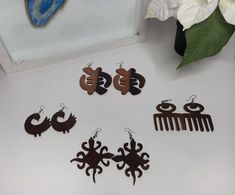 Authentic hand-crafted West African earrings. Perfect as a gift or simply to creatively express and celebrate west African culture. These symbols are know as adinkra symbols and have meaning in the Ghanaian tradition. Unique Brown Earrings For Gift, Artisan Earrings With Artistic Design As A Gift, Artisan Earrings With Artistic Design For Gift, Unique Brown Plug Earrings As Gift, Artisan Brown Earrings For Gift, Traditional Brown Drop Earrings Jewelry, Traditional Brown Drop Earrings, Bohemian Earrings With Unique Design For Gift, Artisan Earrings For Festivals And Gifts