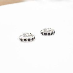 A Pair Of Sterling Silver 925 BLACK CZ Hoop EarringsEarring Inner Diameter: 9 mmEarrings are also available in 14k Gold Filled.♥♥♥♥► Nickel Free► Tarnish Resistant► No Allergic reaction► 30 days return policy► Accept replacements and custom orders♥♥♥♥► I ship all items in a jewelry gift box► Greeting card - upon request♥♥♥♥Shipping information :► Tracking number► Expedited / Express shipping - additional payment¨¨¨¨°º©©º°¨¨¨¨¨¨°º©©º°¨¨¨¨► My Shop: https://www.etsy.com/shop/JewelsByMoonli ¨¨¨¨°º© Adjustable Minimalist Cubic Zirconia Earrings, Adjustable Sterling Silver Huggie Earrings For Anniversary, Black Minimalist Sterling Silver Cartilage Earrings, Nickel-free Small Hoop Black Jewelry, Adjustable Sterling Silver Huggie Earrings, Adjustable Small Hoop Black Jewelry, Black Sterling Silver Hoop Earrings For Everyday, Adjustable Black Small Hoop Jewelry, Black Minimalist Sterling Silver Hoop Earrings