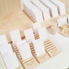 several pieces of wood with white cards on them