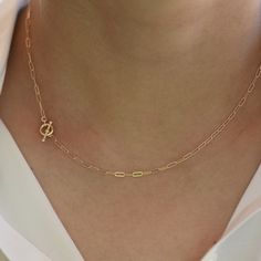 "14K Toggle Necklace, Gold Paper Clip Chain, Delicate Necklace Gold Choker. 14K gold Long Link Chain This necklace can be worn by itself or with other necklaces. *The chain, toggle clasp and all components are 14K solid yellow gold (If you order a 16\" necklace, it will be a toggle clasp plus chain will be 16\".) *The toggle clasp is about 3/8\" The model in the picture wears a 16\" necklace. Please read our policies before you place your order. https://www.etsy.com/shop/SashJewelry/policy?ref=s Classic Yellow Gold Toggle Necklace With Paperclip Chain, Classic Yellow Gold Oval Link Toggle Necklace, Classic Yellow Gold Link Toggle Necklace, Dainty Yellow Gold Toggle Necklace Gift, Classic Gold Toggle Necklace For Everyday, Minimalist Toggle Necklace With Cable Chain For Gift, Elegant Yellow Gold Toggle Necklace With Paperclip Chain, Minimalist Yellow Gold Toggle Link Necklace, Minimalist Yellow Gold Link Toggle Necklace