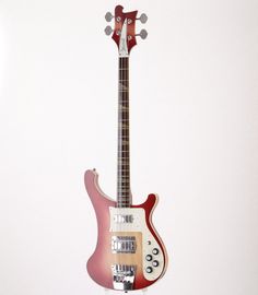 a red and white electric guitar on display