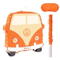 an orange van with flowers and peace sign on the front is next to a white stick