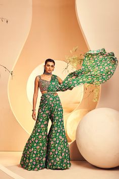 Featuring a botanical floral printed sharara-styled pre-stitched sari which is paired with a fully hand-embellished blouse. The blouse is embroidered with intricate Japanese beads and cutdana embroidery. The belt is accentuated with ruby-coloured drop stones. From Aneesh Agarwaal's Naksh collection. DELIVERY TIMEPlease allow 8-12 weeks for your outfit to arrive. FABRIC DETAILSChinon Chiffon Professional cleaning only. Sharara Saree, Pant Saree, Printed Sharara, Cutdana Embroidery, Heart Coloring Pages, Japanese Beads, Embellished Blouse, Printed Saree, Colored Pants