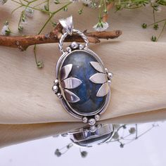 PRODUCT INFORMATION ● Gemstone : Labradorite ● Metal : 925 Sterling Silver ● Purity : 925 Parts Per 1000 ● Stone Shape : Same As Picture ● Stone Category : Cabochon ● Silver Polish : High * Benefits Of Wearing Silver As a metal, silver has significant health benefits that have been used across cultures for centuries. Silver has a proven track record as a powerful antimicrobial agent fighting infections and aiding in cold and flu prevention, wound healing, and more. Silver also helps with interna Handmade Spiritual Sterling Silver Gemstones, Silver Labradorite Gemstone With Large Stone, Sterling Silver Gemstone With Large Stone For Gifting, Oval Labradorite Jewelry Stamped 925, Sterling Silver Gemstone With Large Stone For Gift, Large Silver Labradorite Gemstones, Labradorite Jewelry With Natural Stones For Anniversary, Artisan Labradorite Jewelry For Anniversary, Silver Cabochon Labradorite Gemstones