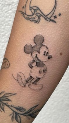 a tattoo with a mickey mouse on it