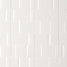 a white wall with vertical lines on it