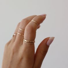 14k gold fill Minimal Midi Ring on models finger. This Ring features a simple band that is smooth perfect for everyday wear. Silver Gold Plated Dainty Midi Rings, Simple Silver 14k Gold Midi Rings, Gold Sterling Silver Minimalist Midi Rings, Minimalist Nickel-free White Gold Midi Rings, Minimalist Sterling Silver Midi Rings With Polished Finish, Minimal Ring, Spiral Ring, Midi Ring, Midi Rings