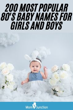 a baby is sitting in the clouds with flowers on her head and wearing bunny ears