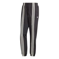 adidas Hack Pant 'Black' HZ0701 Adidas Athleisure Pants With Logo, Sporty Cotton Bottoms With Adidas Logo, Adidas Athleisure Bottoms With Three Stripes, Adidas Relaxed Fit Sweatpants With Three Stripes, Adidas Relaxed Fit Jogging Bottoms, Relaxed Fit Sportswear Bottoms With Three Stripes, Adidas Sportswear Pants With Three Stripes, Adidas Sporty Sweatpants For Spring, Adidas Sportswear Pants For Spring