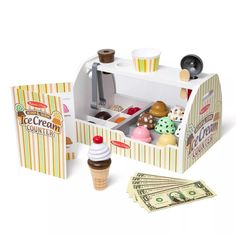 an ice cream shop with money and cupcakes