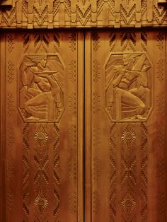 the golden doors are decorated with art nouveau designs