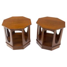 two wooden hexagonal tables sitting side by side on top of eachother